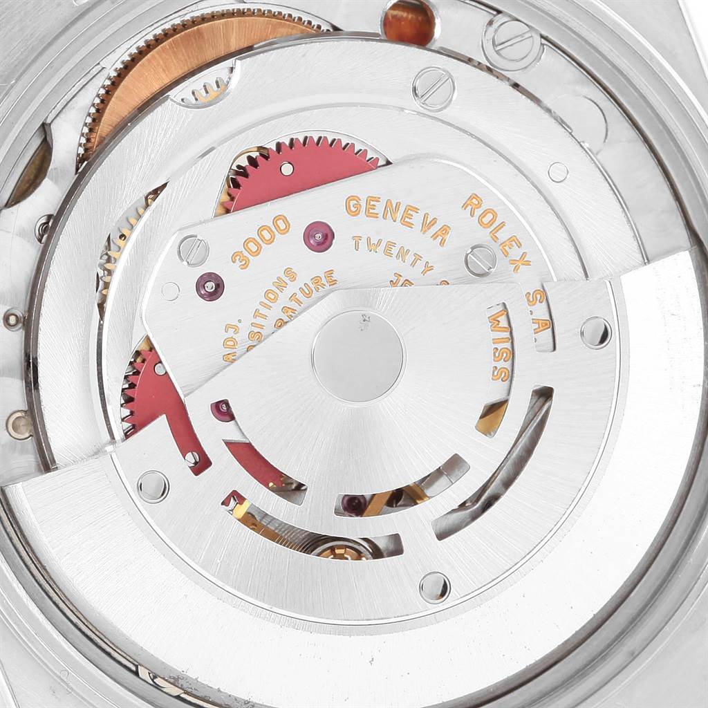 The image shows the movement mechanism of a Rolex Air-King 14000 Men's Stainless Steel Blue Dial 14000 Men's Stainless Steel Blue Dial watch, highlighting gears and parts of the rotor.