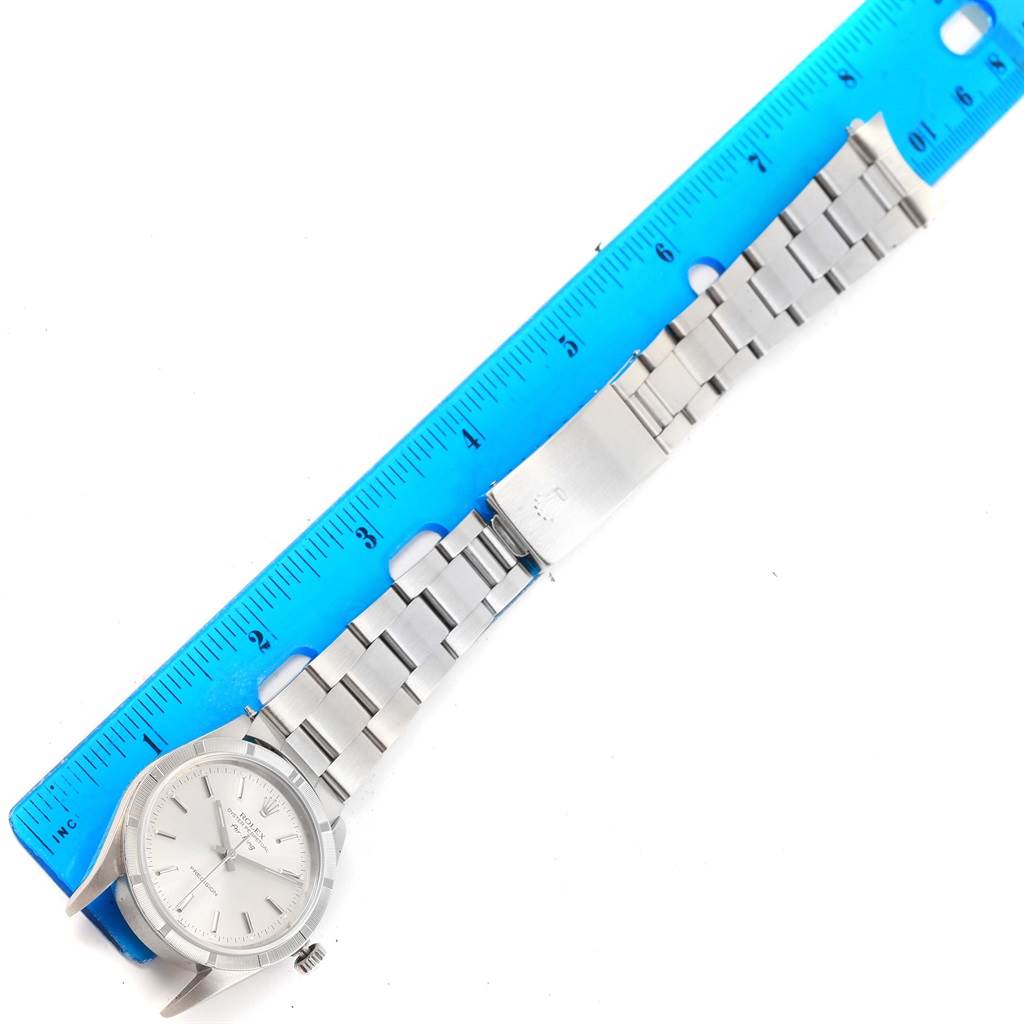 The image shows a Rolex Air-King 14010 Men's Stainless Steel Silver Dial 14010 Men's Stainless Steel Silver Dial watch laid flat with the full bracelet and clasp visible, positioned alongside a ruler for measurement.