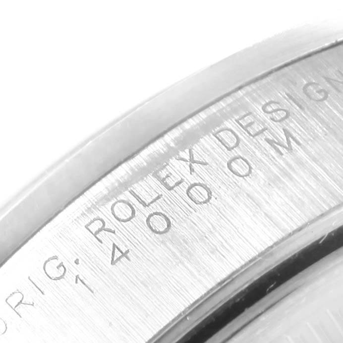 This close-up image shows the engraved inner bezel with "ROLEX DESIGN" and model number details of the Rolex Air-King 14000 Men's Stainless Steel Blue Dial 14000 Men's Stainless Steel Blue Dial watch.