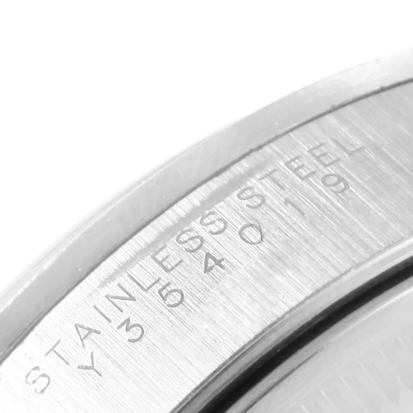 This close-up image shows the edge of the stainless steel back case of a Rolex Air-King 14000 Men's Stainless Steel Blue Dial 14000 Men's Stainless Steel Blue Dial watch.