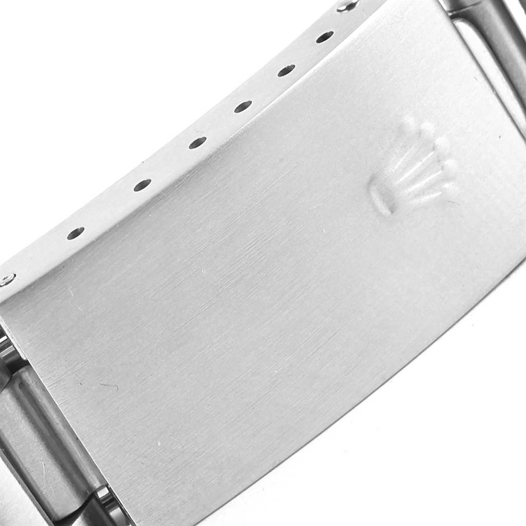 This image shows a close-up view of the clasp of a Rolex Air-King 14010 Stainless Steel Pink Dial 14010 Stainless Steel Pink Dial watch, featuring the Rolex logo.