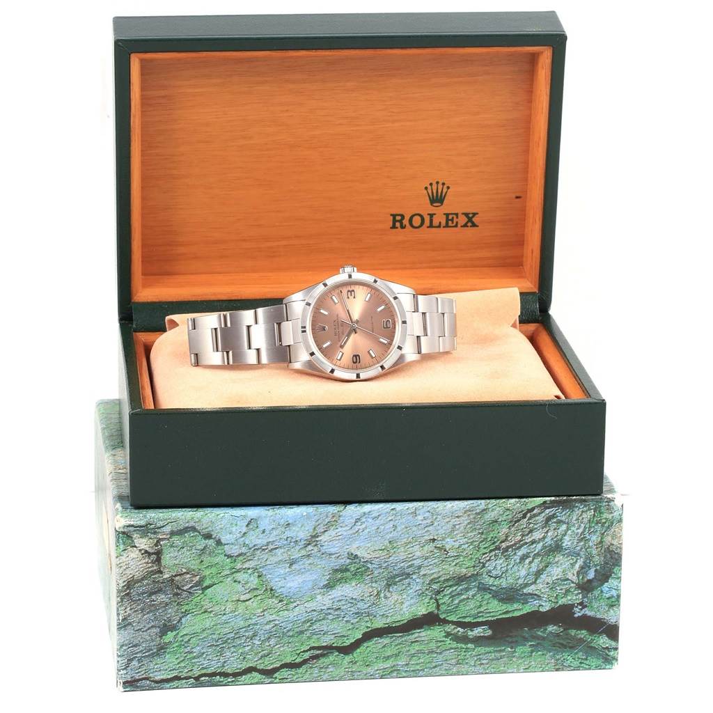 The Rolex Air-King 14010 Stainless Steel Pink Dial 14010 Stainless Steel Pink Dial watch is shown front-facing, inside its open box with the logo visible.