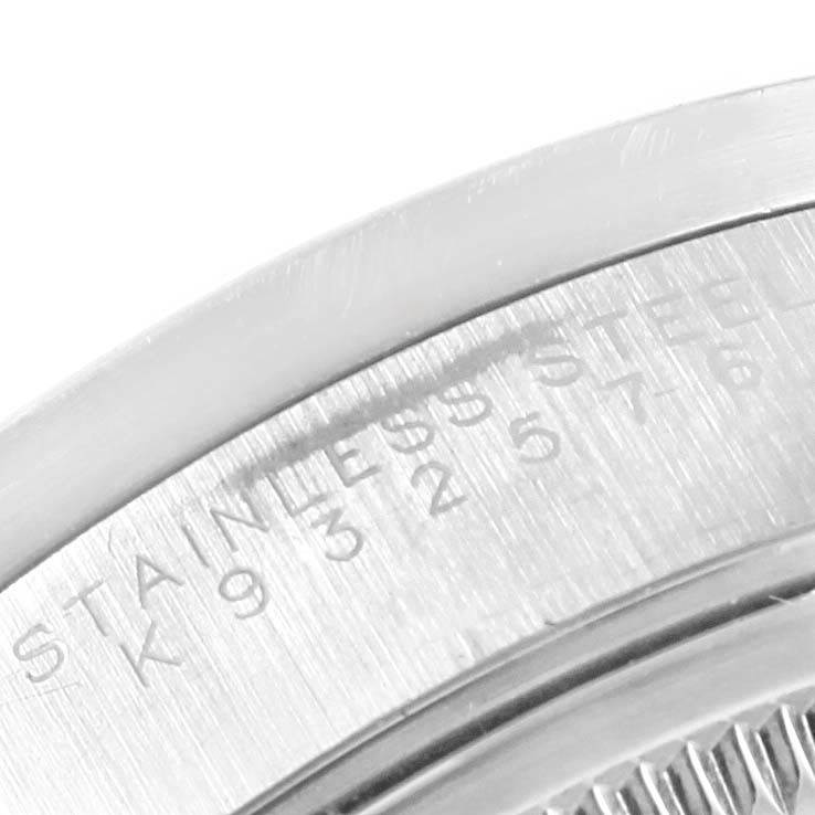 The image shows a close-up of the edge of the stainless steel case back of a Rolex Air-King 14010 Stainless Steel Pink Dial 14010 Stainless Steel Pink Dial watch.