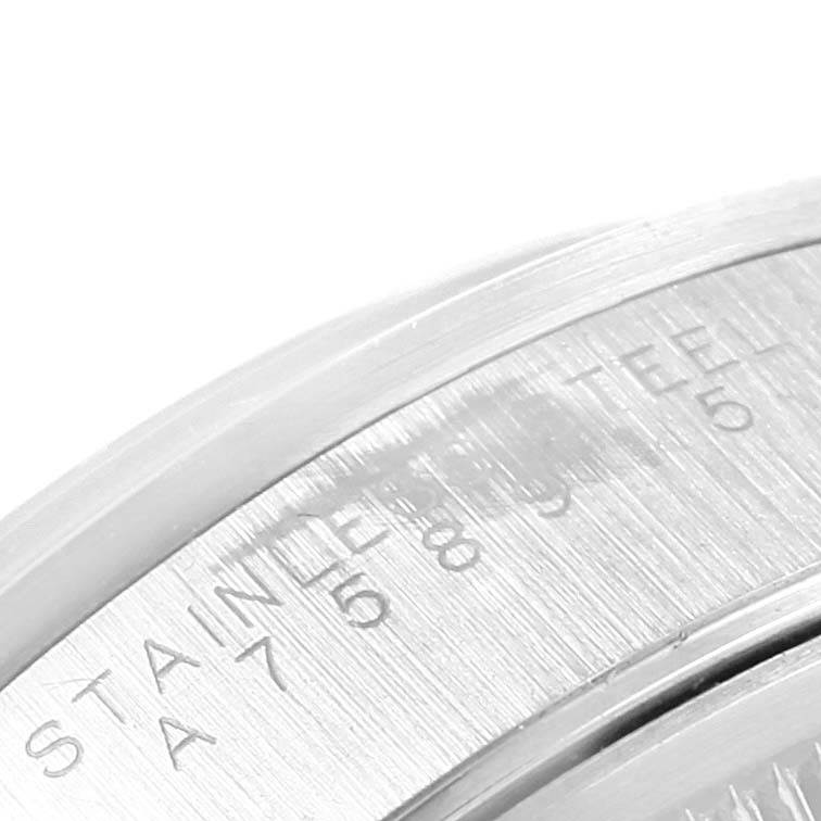 This is a close-up view of the stainless steel casing of a Rolex Air-King 14000 Men's Stainless Steel Blue Dial 14000 Men's Stainless Steel Blue Dial watch, highlighting a portion of the engraved text.