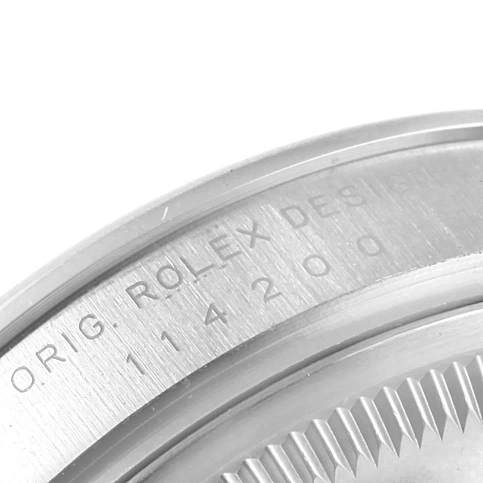 This image shows a close-up of the case back edge of a Rolex Air-King 114200 Men's Stainless Steel Blue Dial 114200 Men's Stainless Steel Blue Dial watch, displaying the engraved model number.