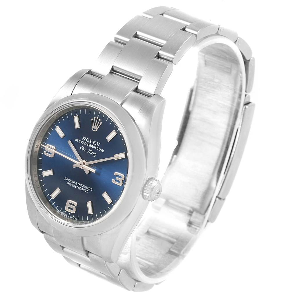 The image shows a Rolex Air-King 114200 Men's Stainless Steel Blue Dial 114200 Men's Stainless Steel Blue Dial watch from an angle that highlights its face, crown, and stainless steel bracelet.