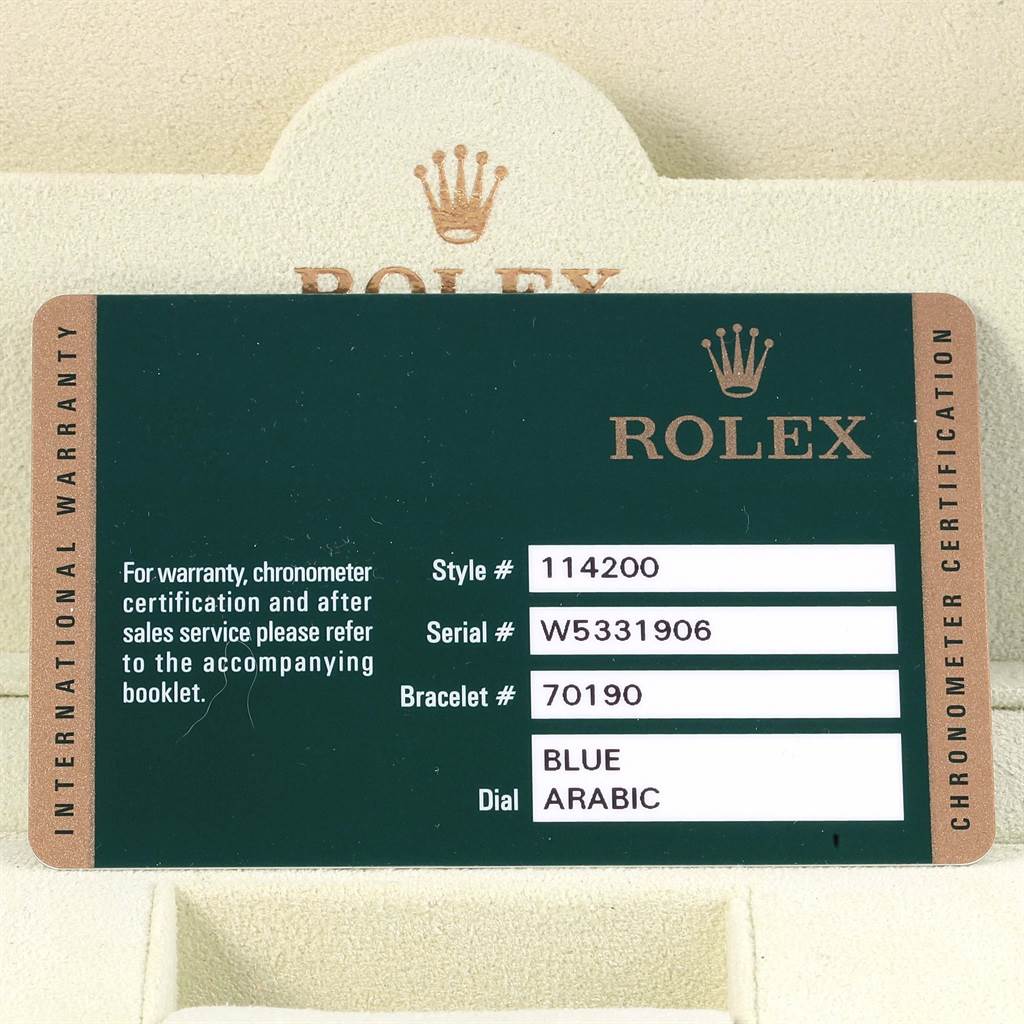 This image shows a warranty card for a Rolex Air-King 114200 Men's Stainless Steel Blue Dial 114200 Men's Stainless Steel Blue Dial watch, displaying model, serial, bracelet numbers, and dial type.