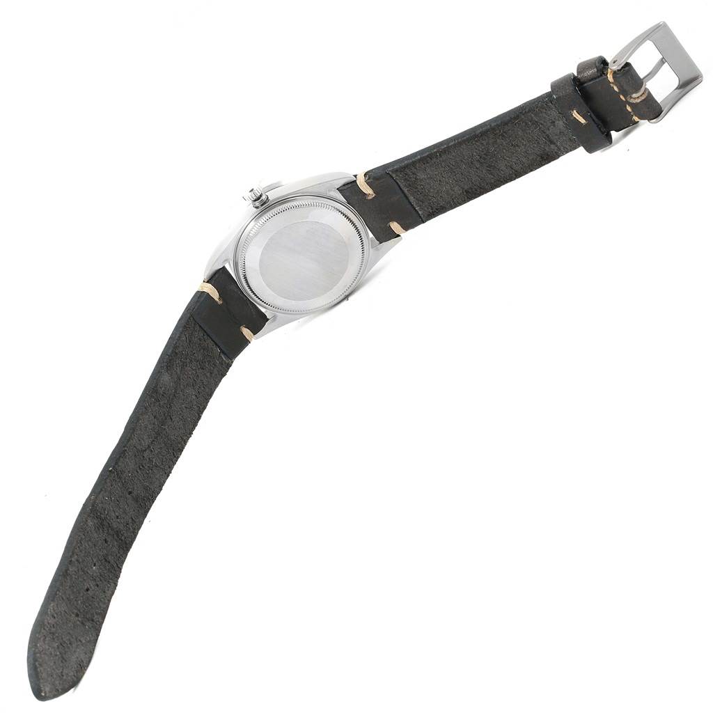 The image shows the back view of a Rolex Air-King 14010 Men's Stainless Steel Black Dial 14010 Men's Stainless Steel Black Dial watch with its leather strap fully extended.