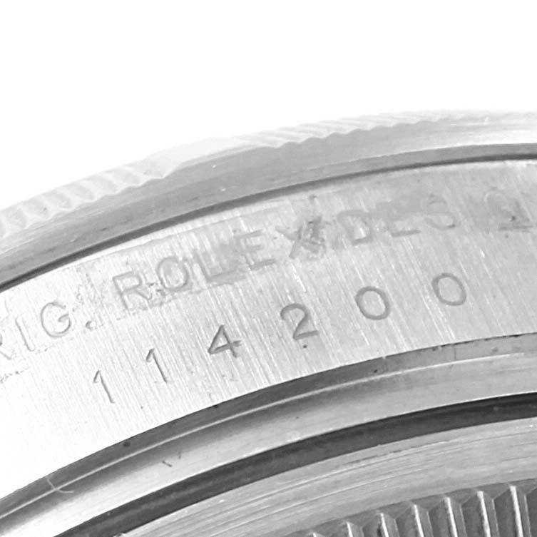 The image shows a close-up of the engraved case back of a Rolex Air-King 114210 Men's Stainless Steel White Dial 114210 Men's Stainless Steel White Dial watch, with model number 114200 visible.