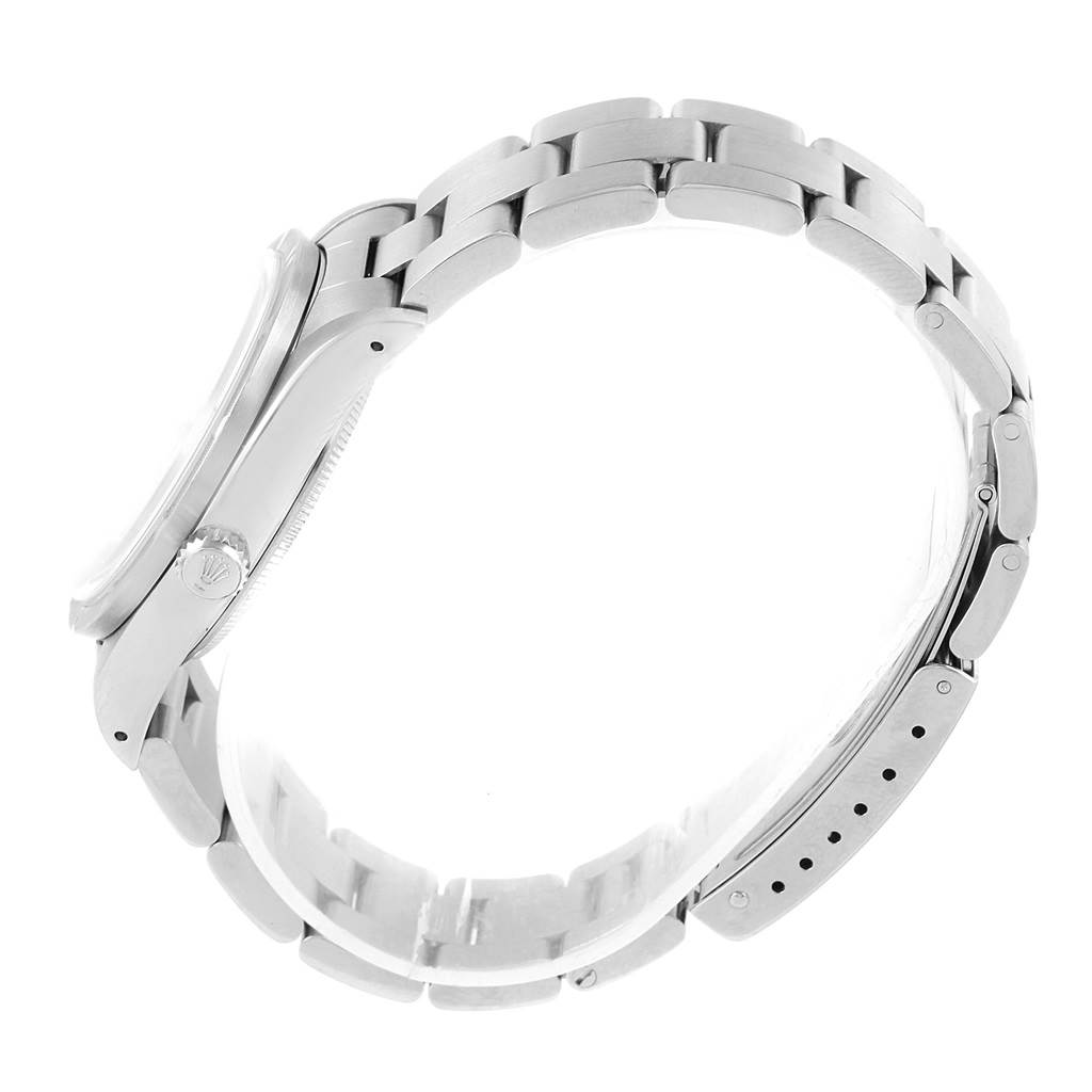 The Rolex Air-King 14010 Men's Stainless Steel White Dial 14010 Men's Stainless Steel White Dial watch is shown in a side view, highlighting its band, case, and the crown with the Rolex logo.