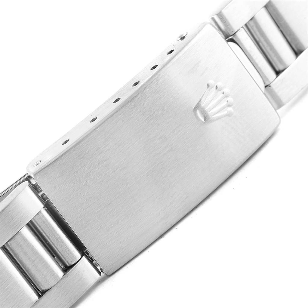 The image shows a close-up of the clasp of a Rolex Air-King 14010 Men's Stainless Steel White Dial 14010 Men's Stainless Steel White Dial watch band.