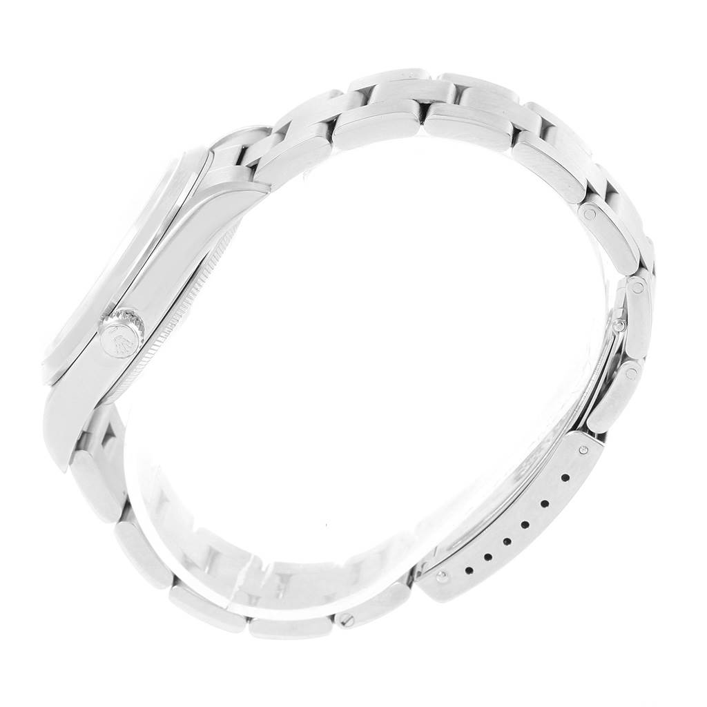 The photo shows a Rolex Air-King 14000 Men's Stainless Steel Silver Dial 14000 Men's Stainless Steel Silver Dial watch from a side angle, highlighting its clasp, bracelet links, and crown.