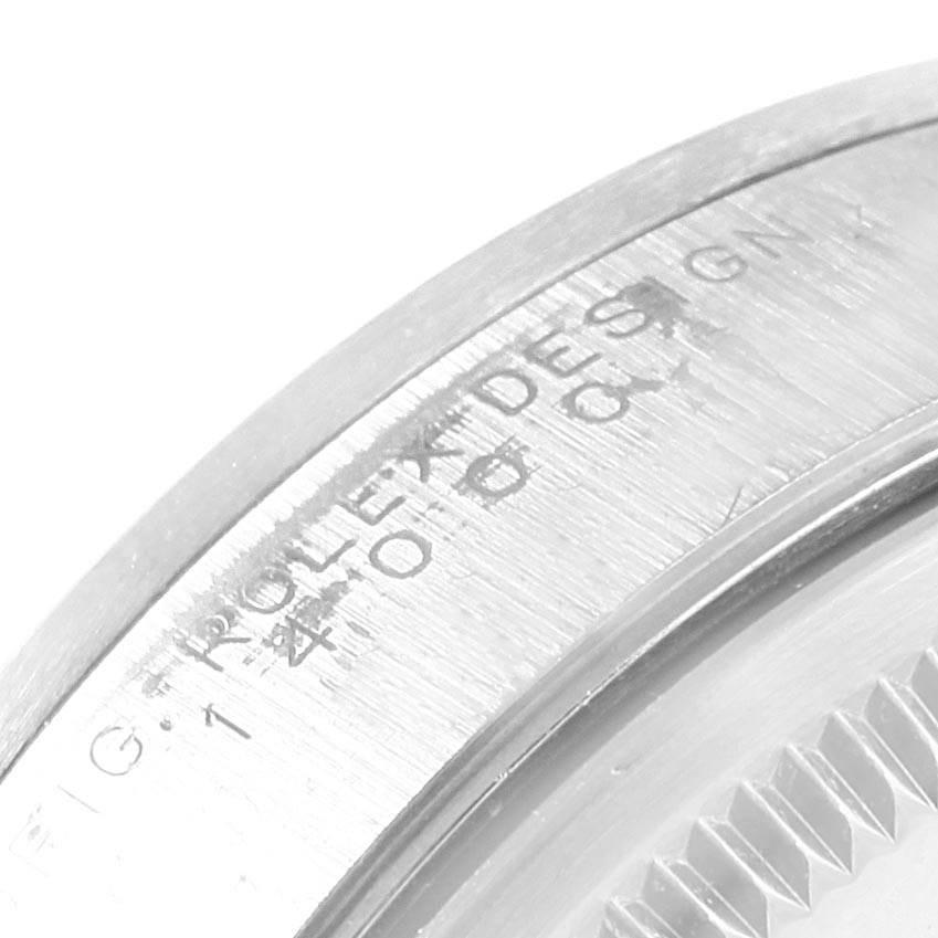 This close-up image shows the engraved bezel of a Rolex Air-King 14000 Men's Stainless Steel Blue Dial 14000 Men's Stainless Steel Blue Dial watch, highlighting the Rolex branding.