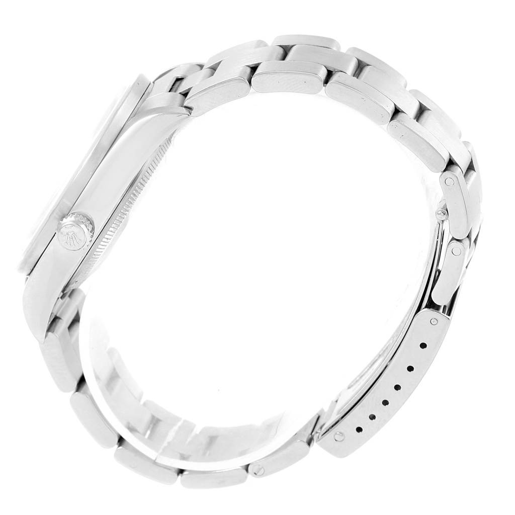 The Rolex Air-King 14010 Stainless Steel Pink Dial 14010 Stainless Steel Pink Dial watch is shown from a side angle, displaying the bracelet, case, and crown.