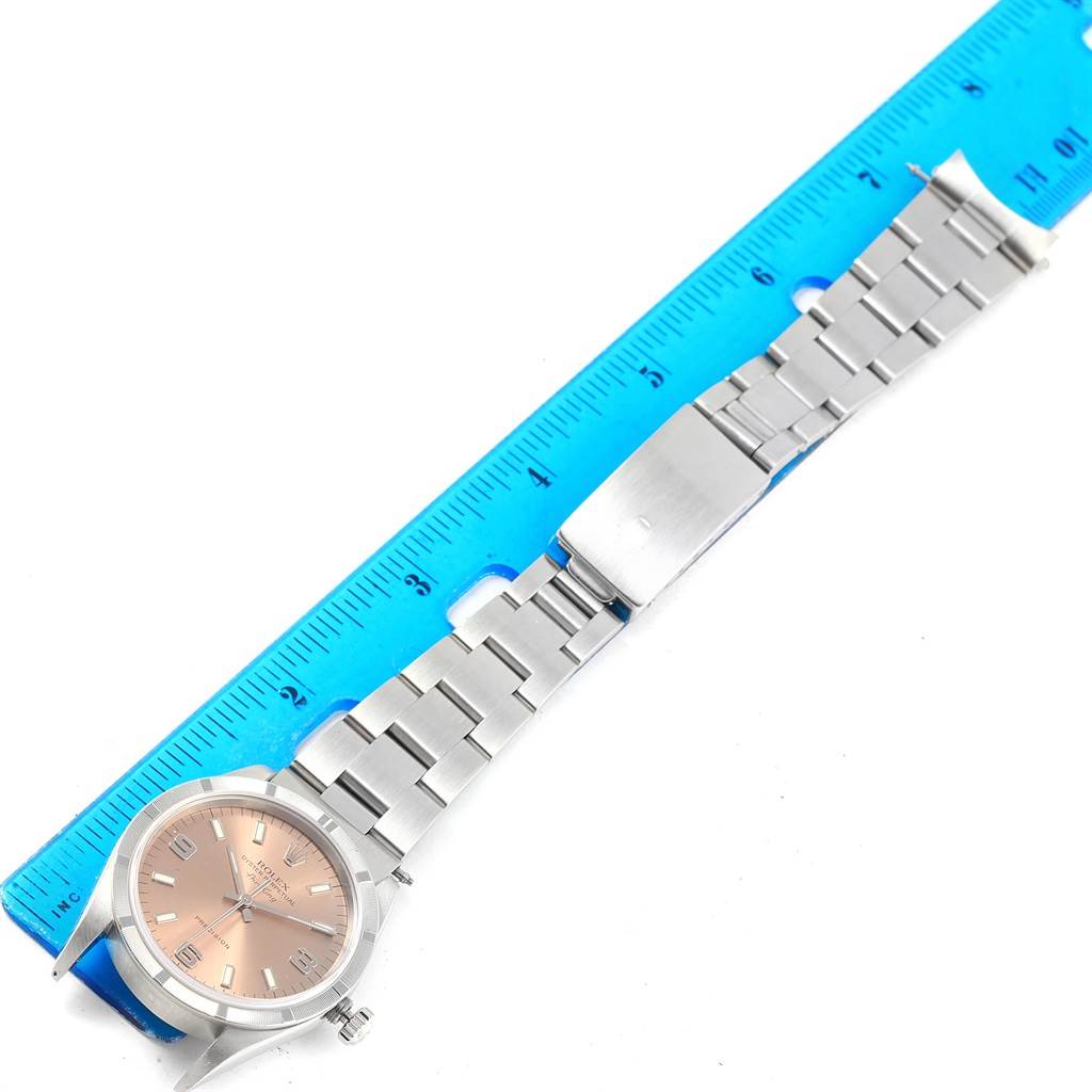 This image shows the full watch and bracelet of a Rolex Air-King 14010 Stainless Steel Pink Dial 14010 Stainless Steel Pink Dial model, measured against a blue ruler.
