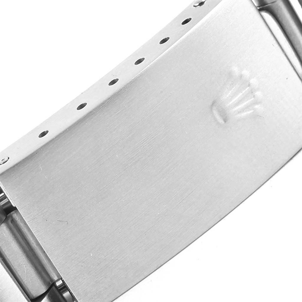A close-up of the clasp of a Rolex Air-King 14010 Stainless Steel Pink Dial 14010 Stainless Steel Pink Dial watch is shown. 
