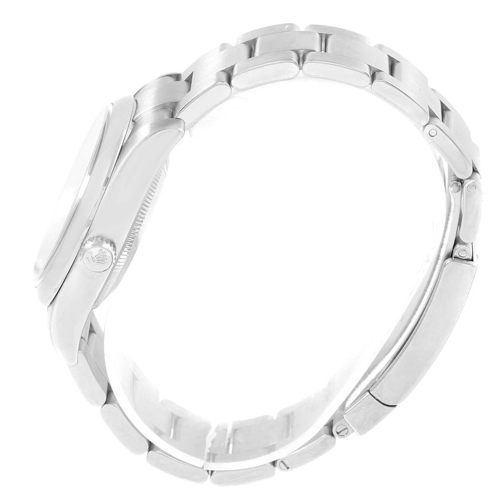 The image shows a side view of the Rolex Air-King 114200 Men's Stainless Steel Blue Dial 114200 Men's Stainless Steel Blue Dial watch focusing on the case, bezel, and bracelet.