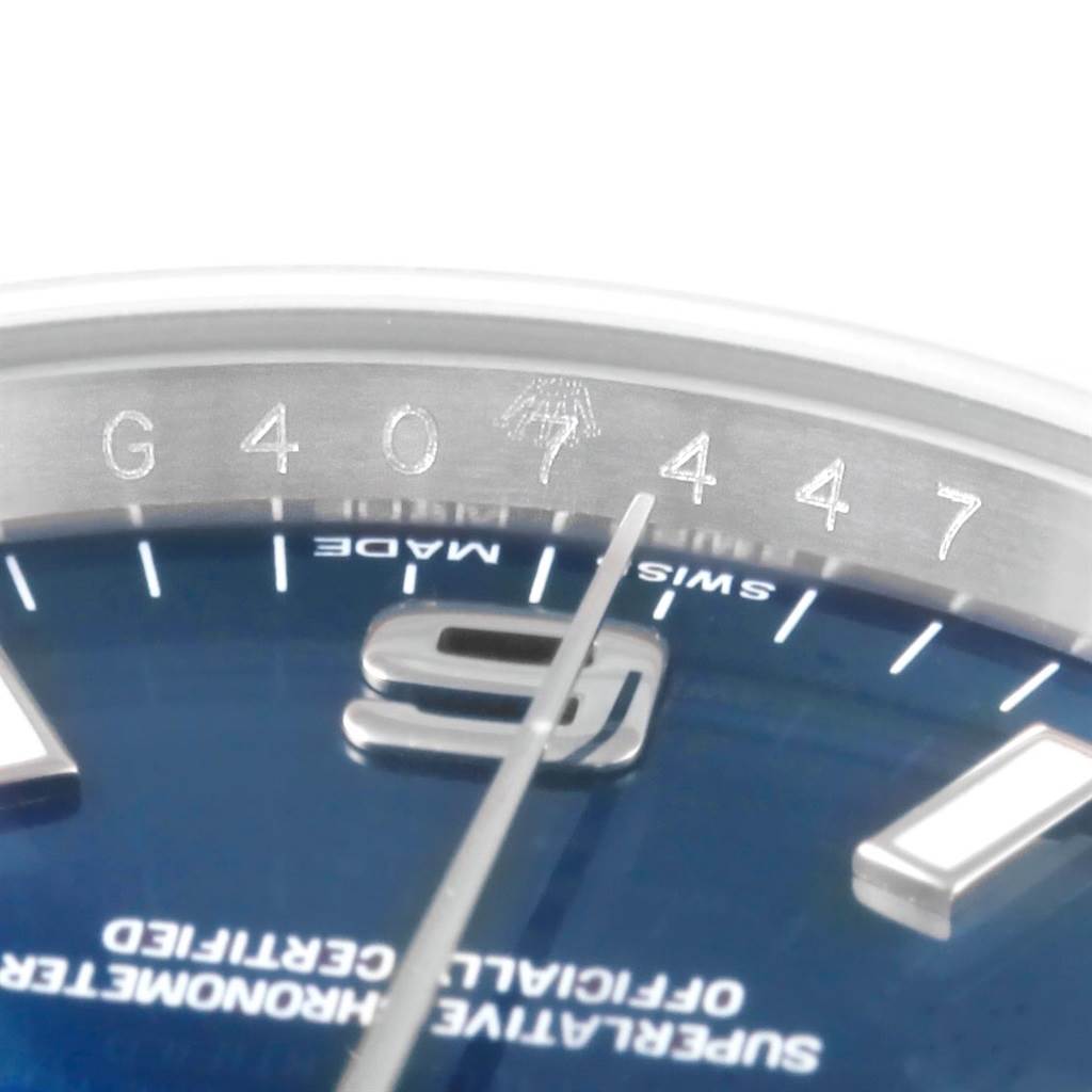 This image shows a close-up of the dial and inner bezel of the Rolex Air-King 114200 Men's Stainless Steel Blue Dial 114200 Men's Stainless Steel Blue Dial watch, highlighting the model number and part of the minute hand.