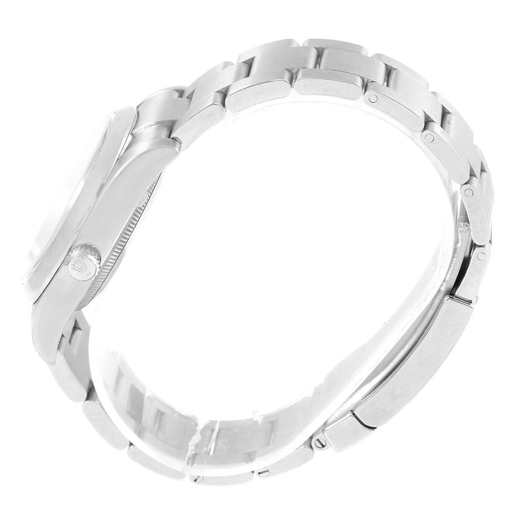 The image shows a Rolex Air-King 114200 Men's Stainless Steel Blue Dial 114200 Men's Stainless Steel Blue Dial watch from a side angle, highlighting the bracelet and the crown.