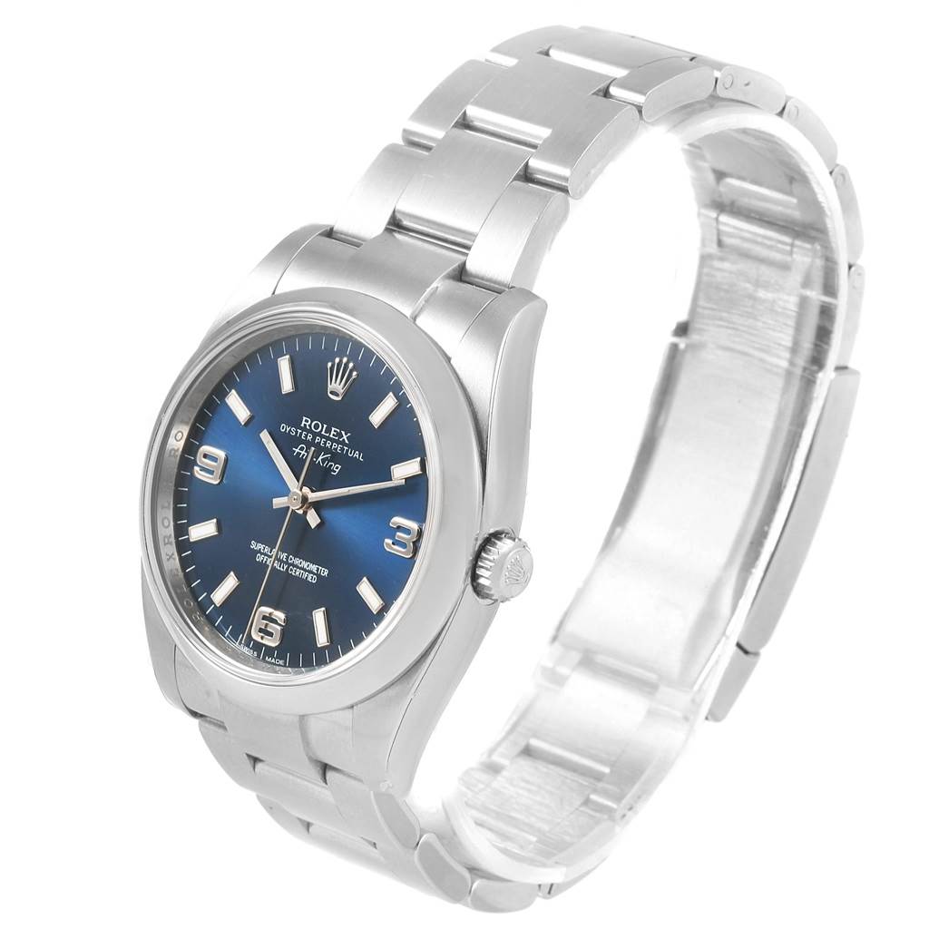 The Rolex Air-King 114200 Men's Stainless Steel Blue Dial 114200 Men's Stainless Steel Blue Dial watch is shown at an angle displaying the dial, case, crown, and bracelet.