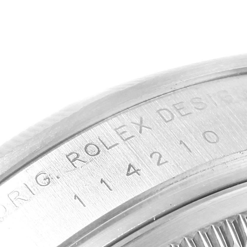 The image shows a close-up of the model number engraved on the case back of a Rolex Air-King 114210 Men's Stainless Steel Silver Dial 114210 Men's Stainless Steel Silver Dial watch.