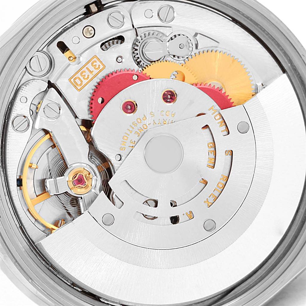 The image shows a close-up view of the internal mechanism of a Rolex Air-King 14010 Men's Stainless Steel Blue Dial 14010 Men's Stainless Steel Blue Dial watch, highlighting gears and movement parts.