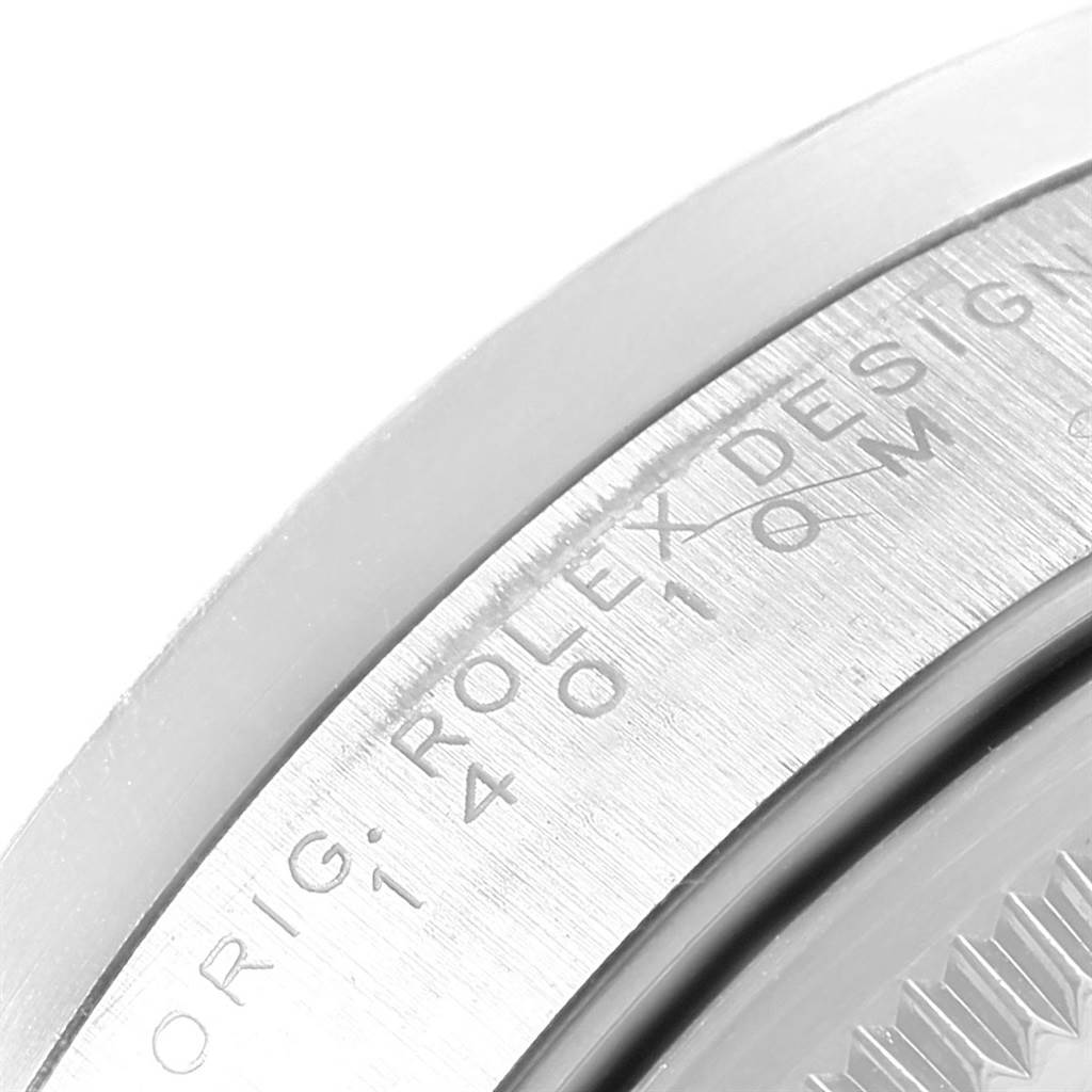 The image shows a close-up of the engraved bezel on a Rolex Air-King 14010 Men's Stainless Steel Blue Dial 14010 Men's Stainless Steel Blue Dial watch.