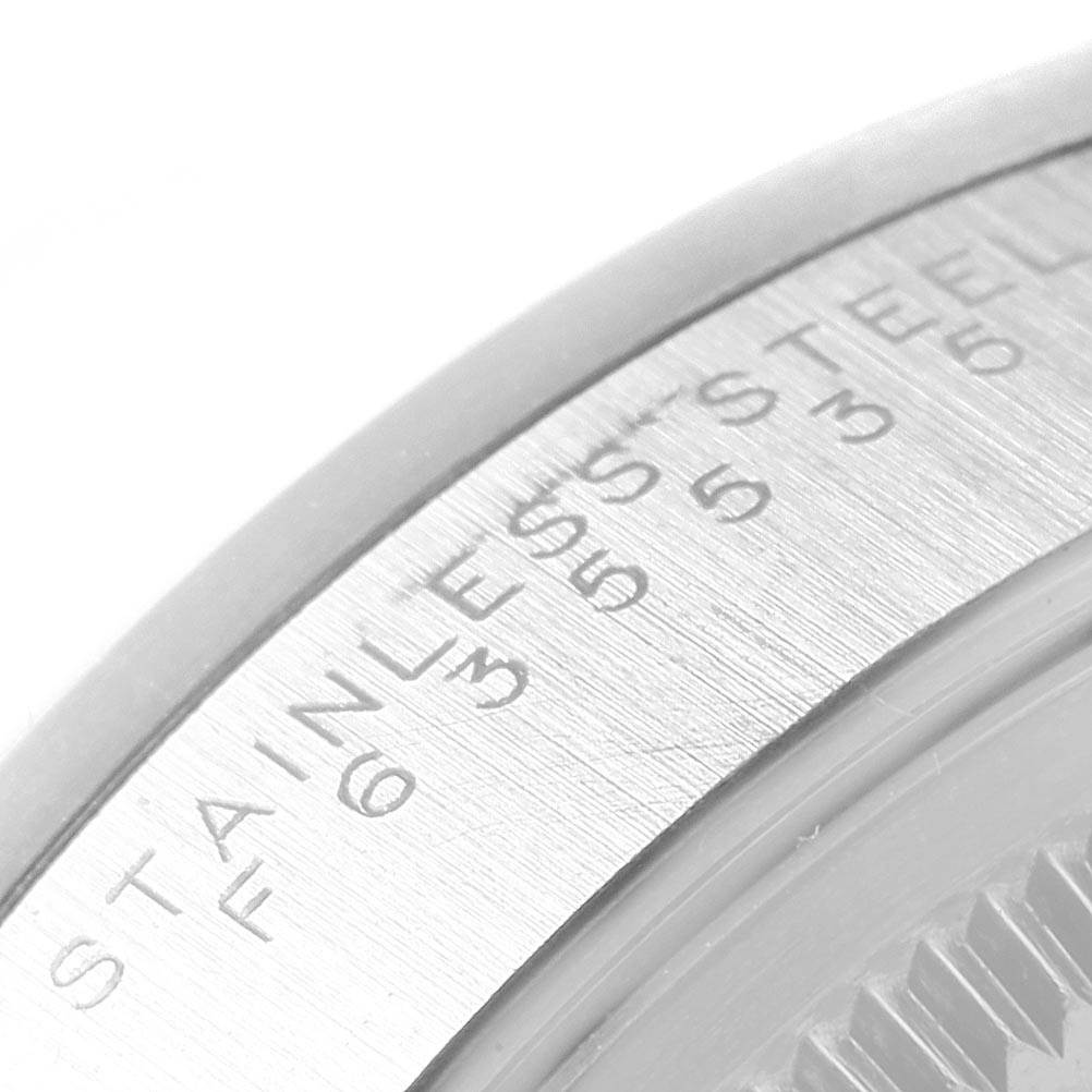 This close-up image shows the stainless steel back of the Rolex Air-King 14000 Men's Stainless Steel Black Dial 14000 Men's Stainless Steel Black Dial watch, focusing on the engraved text and outer rim.