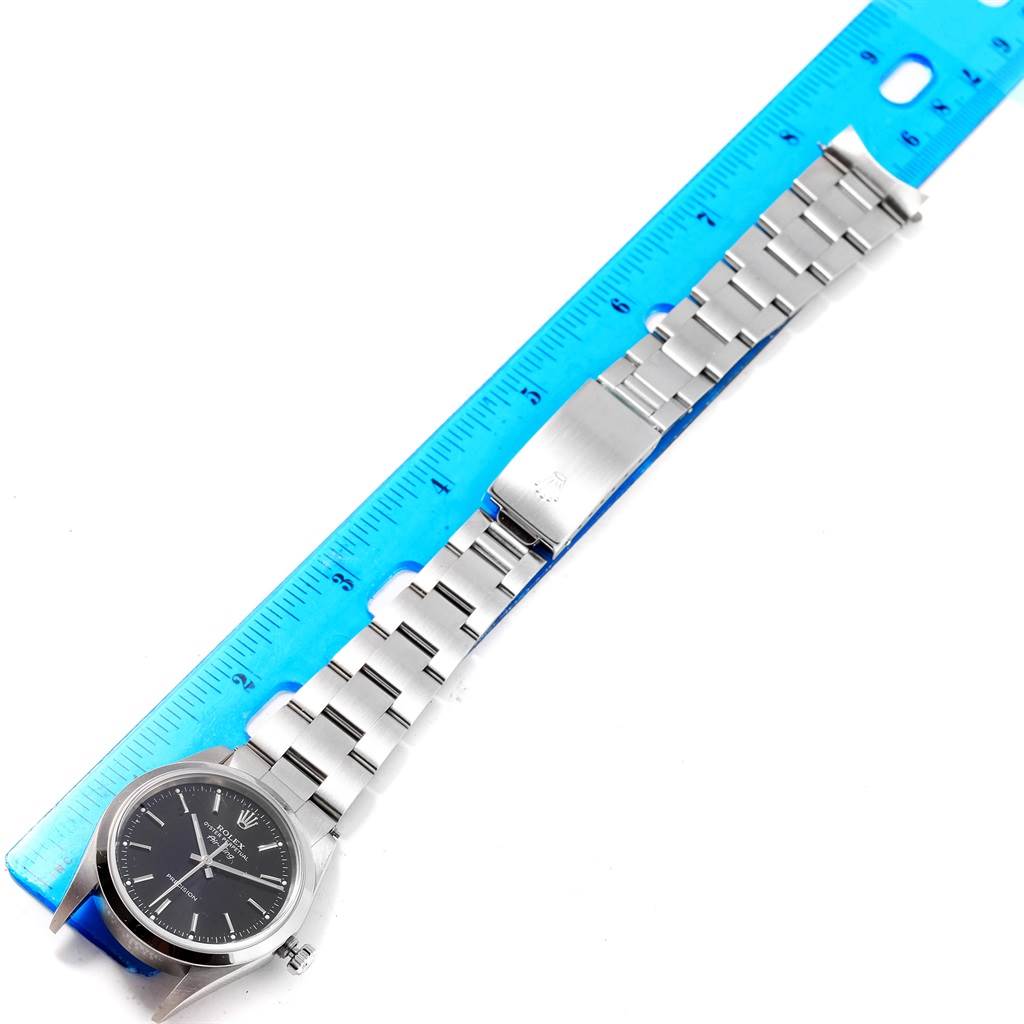 The image shows a Rolex Air-King 14000 Men's Stainless Steel Black Dial 14000 Men's Stainless Steel Black Dial watch laid flat alongside a blue ruler, displaying its face, bracelet, and clasp.