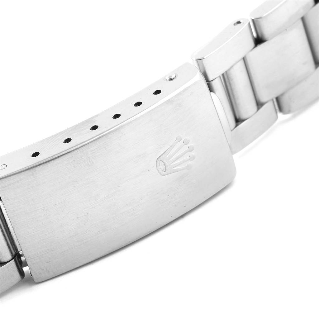 This image shows a close-up of the clasp and part of the bracelet of a Rolex Air-King 14010 Men's Stainless Steel Silver Dial 14010 Men's Stainless Steel Silver Dial watch.