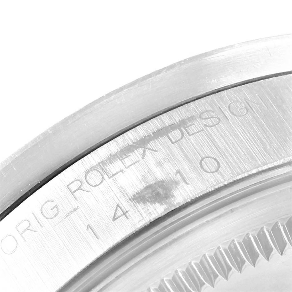 The image shows a close-up of the engraved case back of the Rolex Air-King 14010 Men's Stainless Steel Silver Dial 14010 Men's Stainless Steel Silver Dial watch, highlighting the branding and serial number.