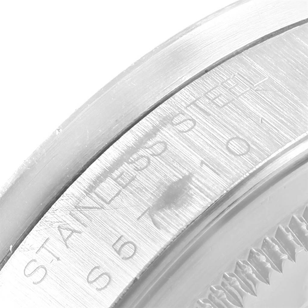 The image shows a close-up of the stainless steel case back from a side angle of the Rolex Air-King 14010 Men's Stainless Steel Silver Dial 14010 Men's Stainless Steel Silver Dial watch.