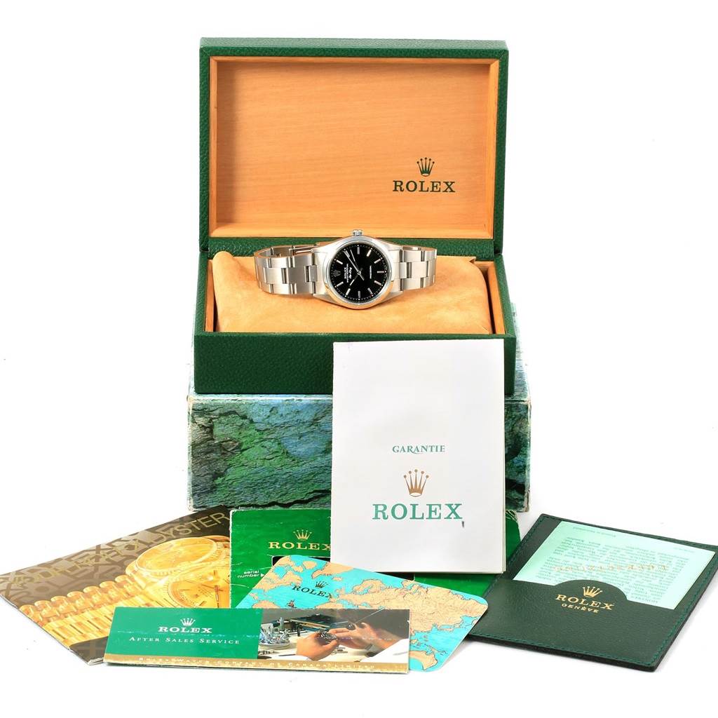 The image shows a Rolex Air-King 14000 Men's Stainless Steel Black Dial 14000 Men's Stainless Steel Black Dial watch in an open box with accompanying warranty booklets and cards.