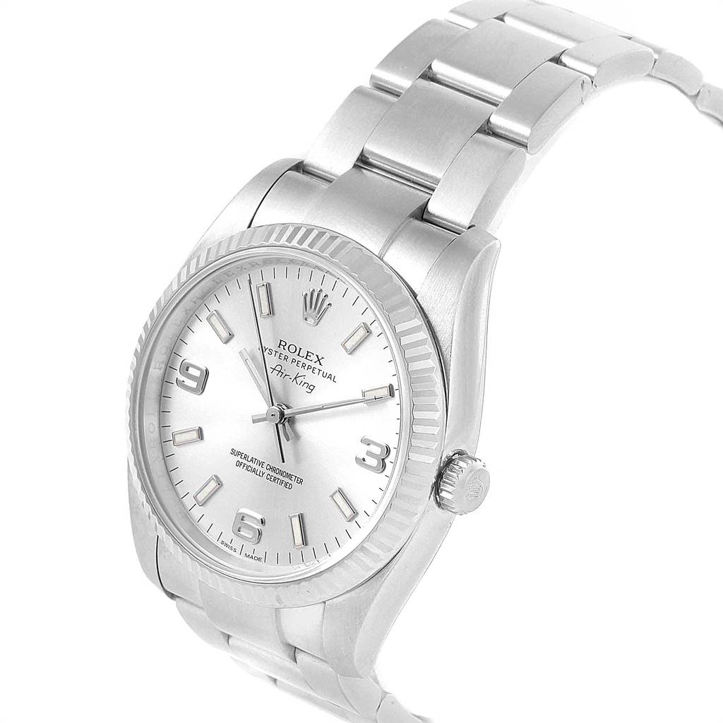 The Rolex Air-King 114234 Men's Stainless Steel Silver Dial 114234 Men's Stainless Steel Silver Dial watch is shown at an angle displaying its face, bezel, crown, and part of the bracelet.