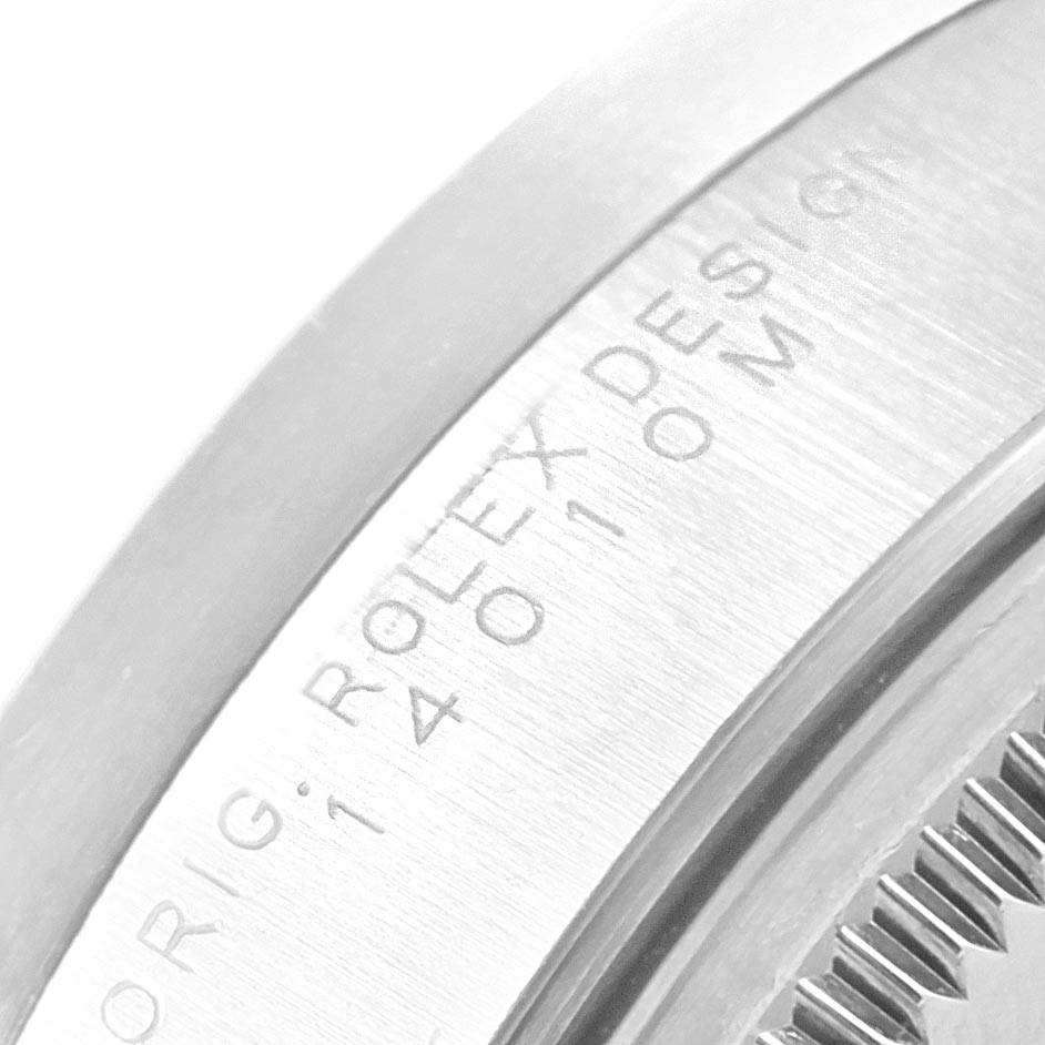 The image shows a close-up of the engraved side of the Air-King model by Rolex.