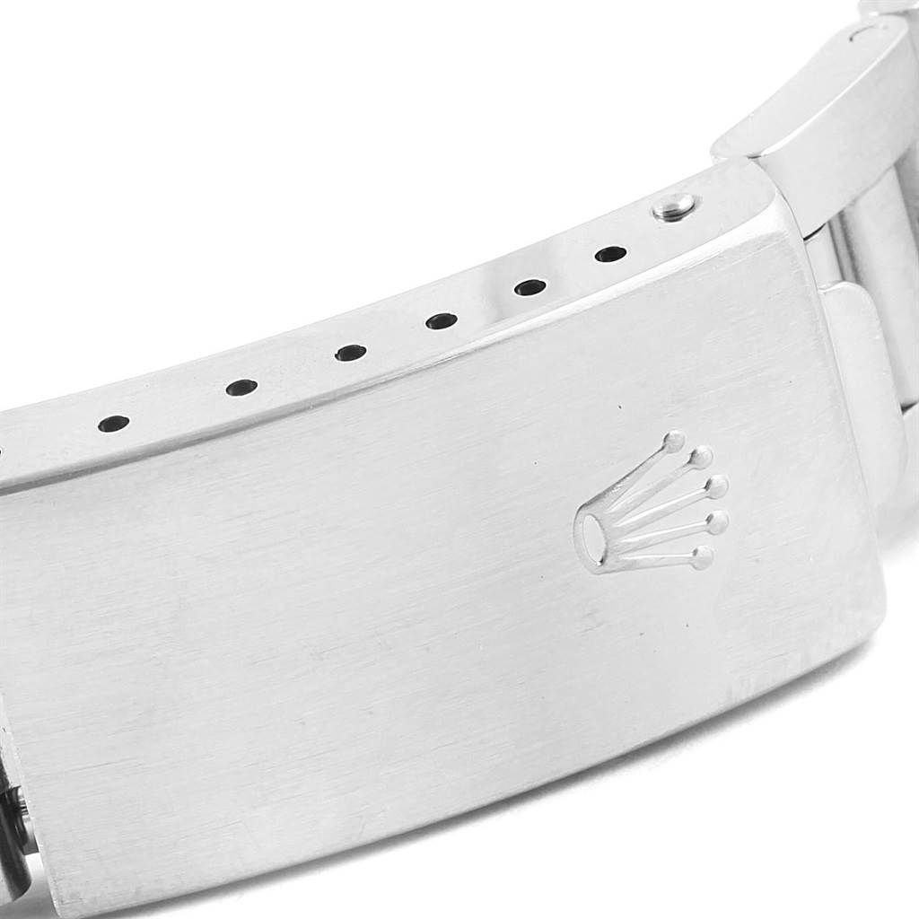 The image shows the clasp of a Rolex Air-King 14010 Men's Stainless Steel Blue Dial 14010 Men's Stainless Steel Blue Dial watch, featuring the brand's logo.