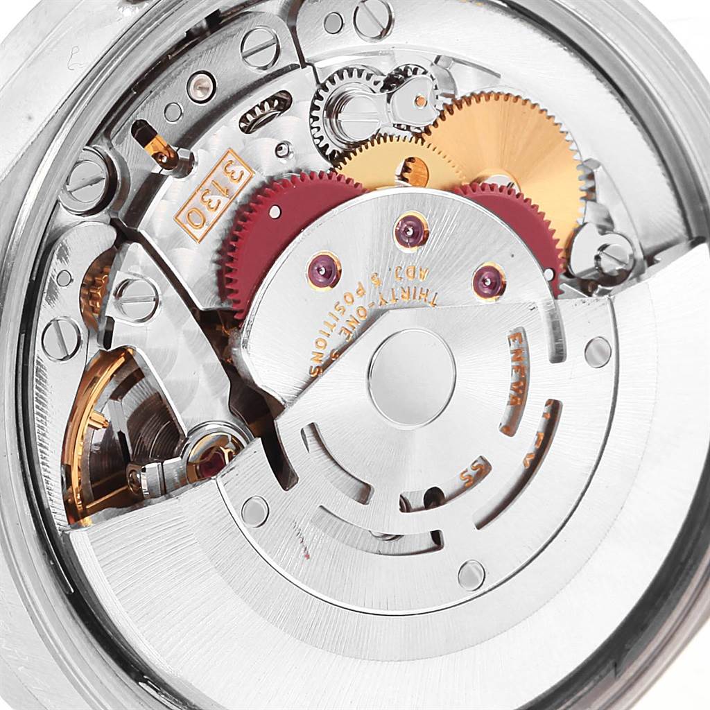 The image shows a close-up view of the mechanical movement inside the Rolex Air-King 14010 Men's Stainless Steel Blue Dial 14010 Men's Stainless Steel Blue Dial watch, highlighting gears and other intricate parts.