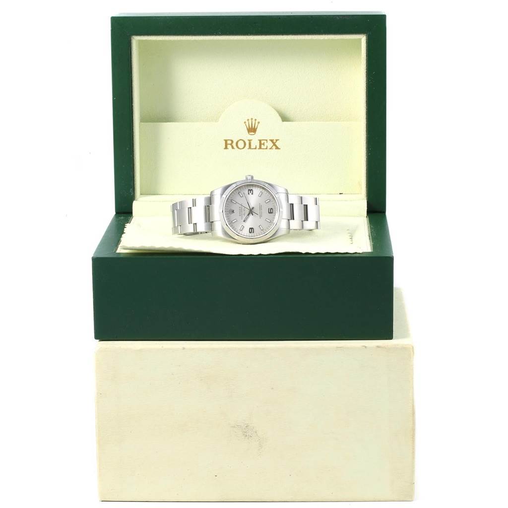 The Rolex Air-King 114210 Men's Stainless Steel Silver Dial 114210 Men's Stainless Steel Silver Dial watch is displayed front-on in its open box, showing the face and bracelet.