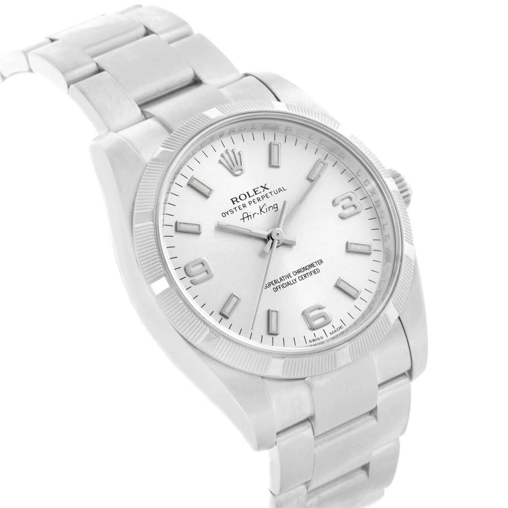 The Rolex Air-King 114210 Men's Stainless Steel Silver Dial 114210 Men's Stainless Steel Silver Dial watch is shown at a slight angle, displaying the face, bezel, crown, and part of the metal bracelet.