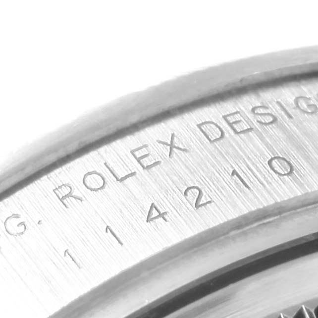 The image shows a close-up view of the side case engraving on a Rolex Air-King 114210 Men's Stainless Steel Silver Dial 114210 Men's Stainless Steel Silver Dial watch.