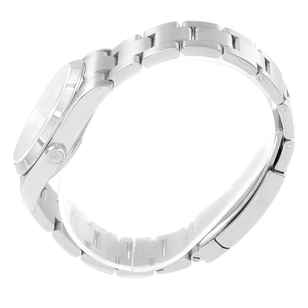 This image shows a side view of the Rolex Air-King 114210 Men's Stainless Steel Silver Dial 114210 Men's Stainless Steel Silver Dial watch, highlighting its bezel, crown, and bracelet.