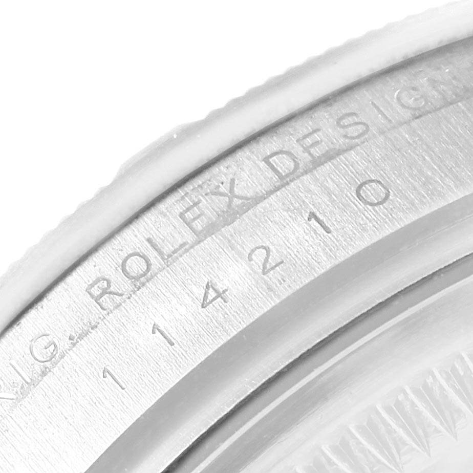 This is a close-up of the case back of the Rolex Air-King 114210 Men's Stainless Steel Blue Dial 114210 Men's Stainless Steel Blue Dial watch, showing the Rolex design engraving and model number.