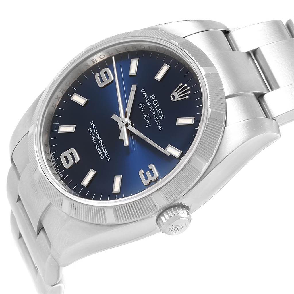 The image shows a side angle of a Rolex Air-King 114210 Men's Stainless Steel Blue Dial 114210 Men's Stainless Steel Blue Dial watch, highlighting the bezel, dial, case, crown, and part of the bracelet.