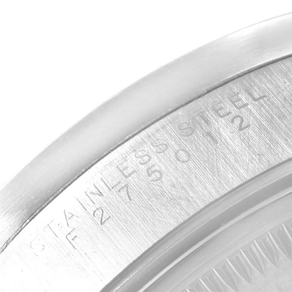 Close-up of the caseback edge on a Rolex Air-King 14010 Men's Stainless Steel Black Dial 14010 Men's Stainless Steel Black Dial, showing "STAINLESS STEEL" engraving.