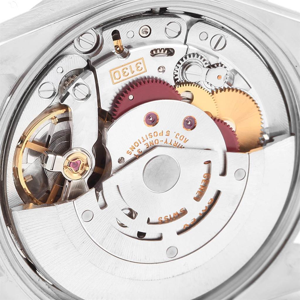 This is an internal view of the Rolex Air-King 14010 Men's Stainless Steel Black Dial 14010 Men's Stainless Steel Black Dial watch, showcasing its detailed mechanical movement and components.