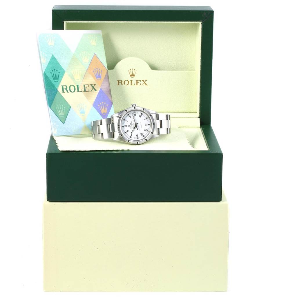 The Rolex Air-King 14010 Men's Stainless Steel White Dial 14010 Men's Stainless Steel White Dial watch is displayed front-facing in its open green and beige box, accompanied by a booklet.