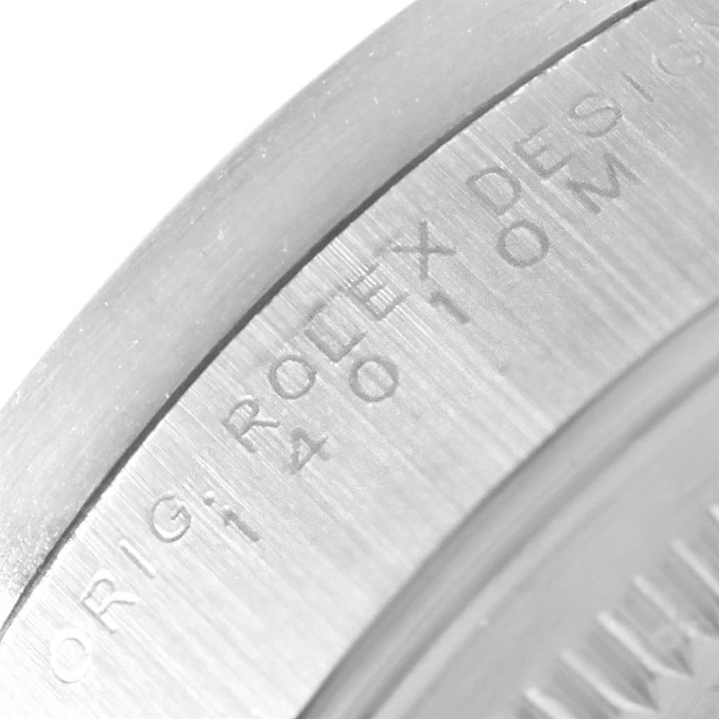 The image shows a close-up of the engraved text on the side of the Rolex Air-King 14010 Men's Stainless Steel White Dial 14010 Men's Stainless Steel White Dial watch case.