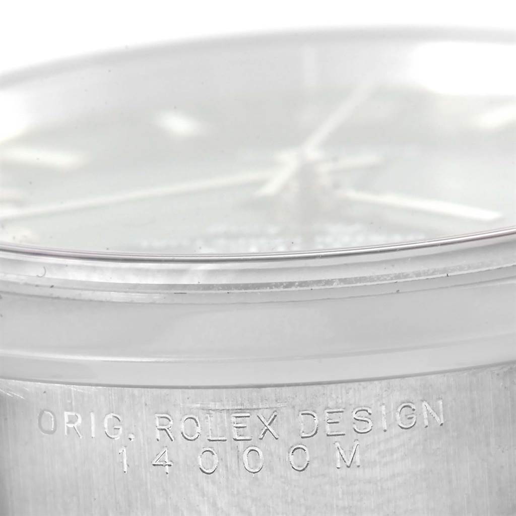 This close-up image shows the side of a Rolex Air-King 14000 Men's Stainless Steel Blue Dial 14000 Men's Stainless Steel Blue Dial watch case, highlighting the "ORIG. ROLEX DESIGN 14000M" engraving.