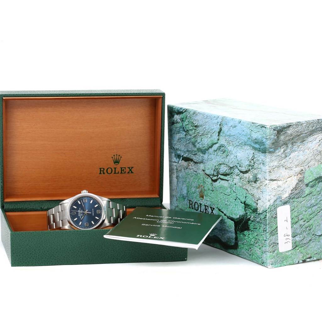 The image shows a Rolex Air-King 14000 Men's Stainless Steel Blue Dial 14000 Men's Stainless Steel Blue Dial watch in its open box, alongside its paperwork and outer packaging.