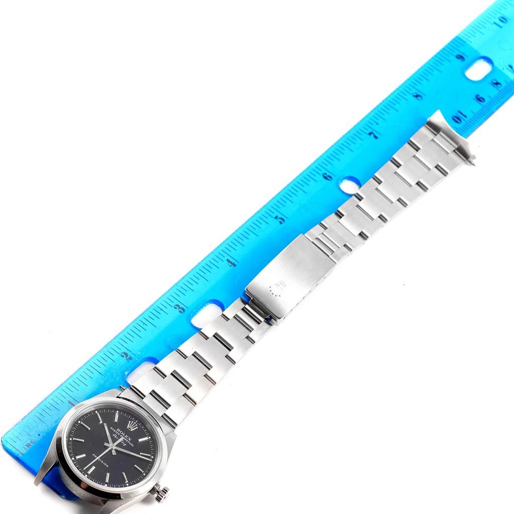 The image shows a Rolex Air-King 14000 Men's Stainless Steel Black Dial 14000 Men's Stainless Steel Black Dial watch laid flat alongside a ruler, displaying the face, crown, and bracelet.